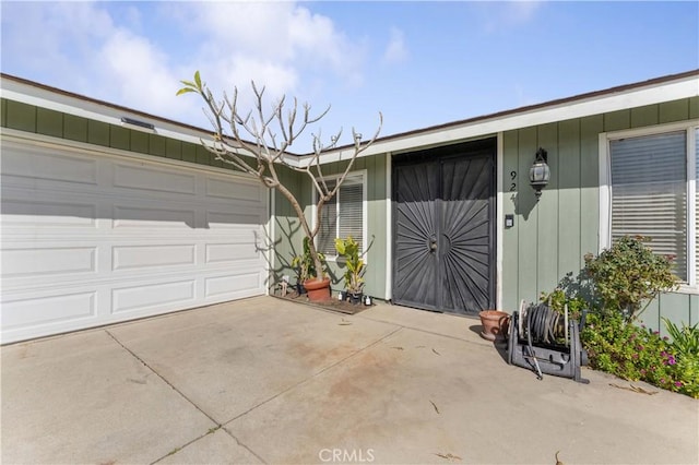 garage featuring driveway