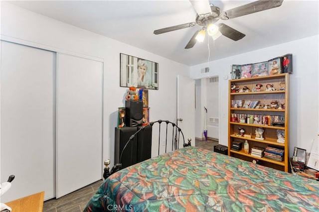 bedroom with a closet, visible vents, and a ceiling fan