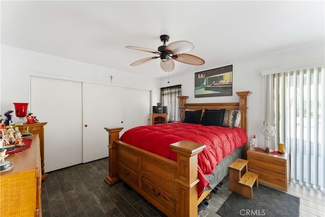 bedroom featuring a ceiling fan, a closet, and wood finished floors