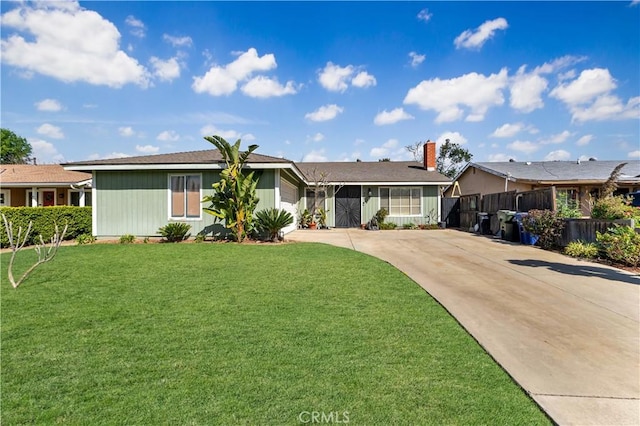 ranch-style house with concrete driveway, a front lawn, and fence