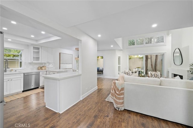 living room featuring baseboards, dark wood-type flooring, and recessed lighting