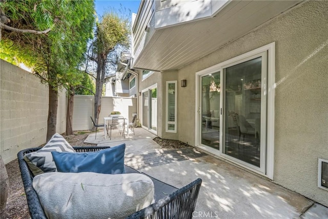 view of patio featuring outdoor dining area, a fenced backyard, and outdoor lounge area