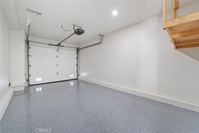 garage featuring baseboards and a garage door opener