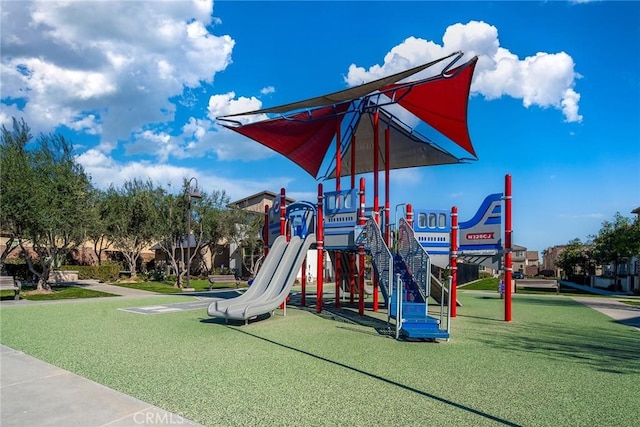 community playground featuring a lawn