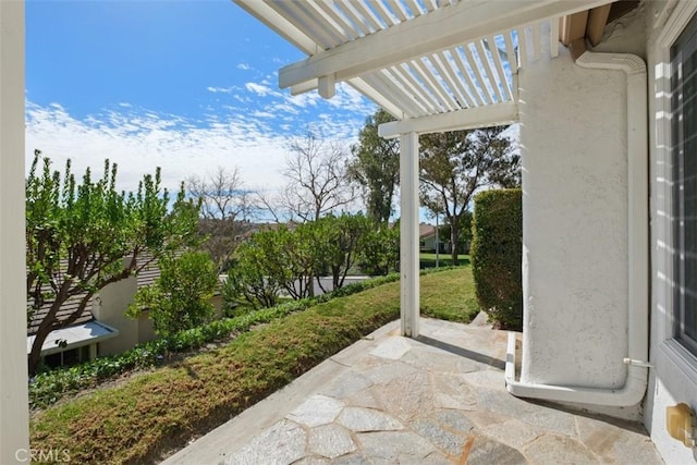 view of patio featuring a pergola