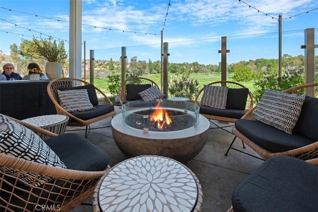 view of patio / terrace featuring an outdoor fire pit