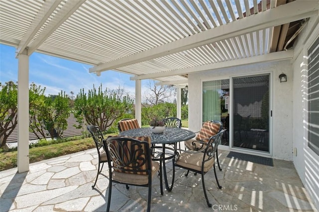 view of patio / terrace with outdoor dining space and a pergola