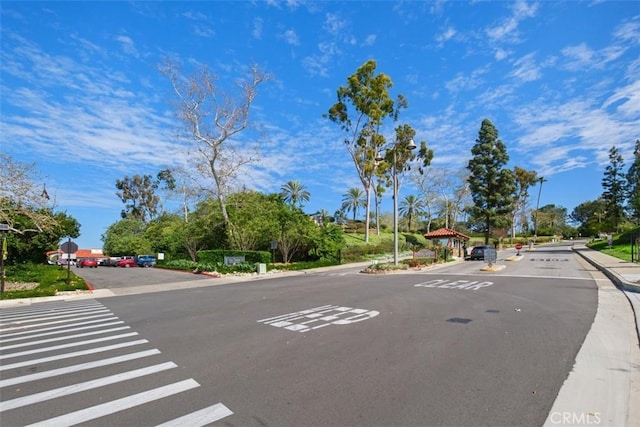 view of street featuring curbs