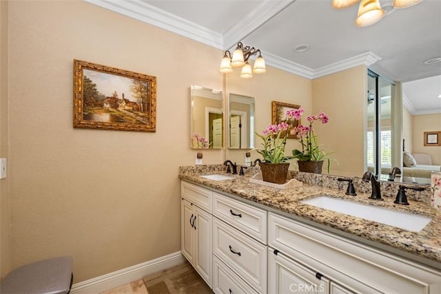 full bath featuring baseboards, double vanity, a sink, and crown molding