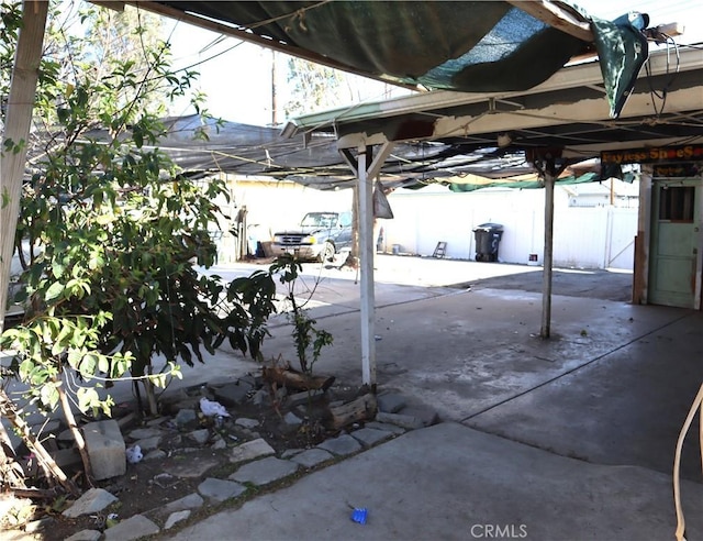 view of patio featuring fence