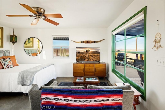 bedroom with ceiling fan and baseboards