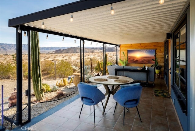 sunroom with a mountain view