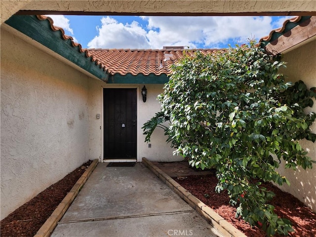 42397 Santiago Dr, Hemet, CA 92544 - entrance to property with a tiled roof and stucco siding