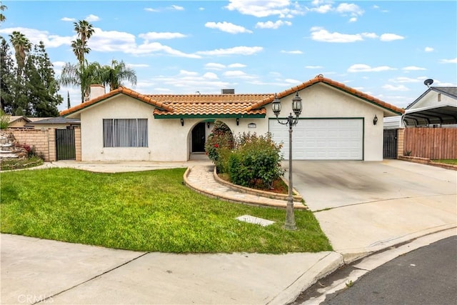 42397 Santiago Dr, Hemet, CA 92544 - mediterranean / spanish-style house with a front lawn, a tiled roof, driveway, fence, and stucco siding