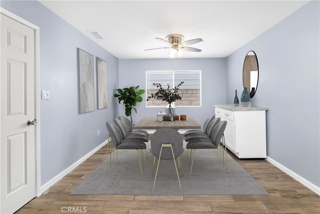 42397 Santiago Dr, Hemet, CA 92544 - dining space featuring baseboards, a ceiling fan, wood finished floors, and visible vents