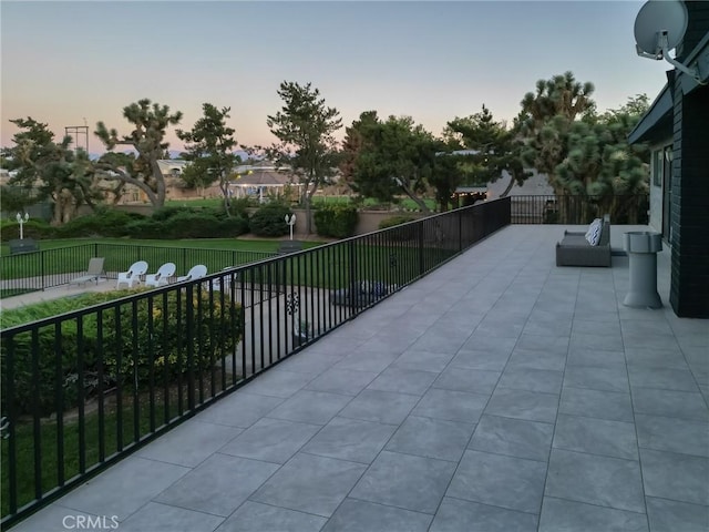 patio terrace at dusk with fence