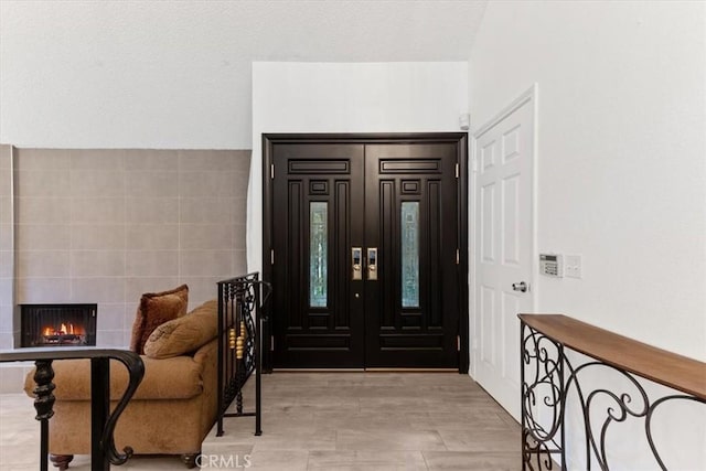 foyer with a fireplace