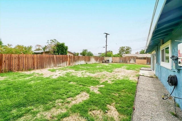 view of yard with a fenced backyard