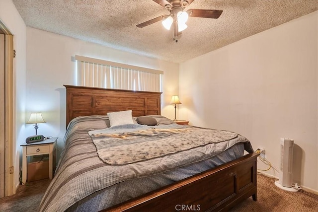 bedroom with carpet, ceiling fan, and a textured ceiling