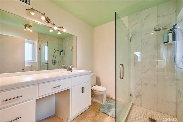 bathroom featuring visible vents, toilet, vanity, and a marble finish shower