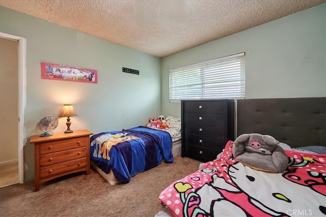 carpeted bedroom with a textured ceiling