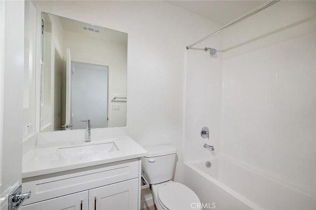 bathroom with toilet, visible vents, bathing tub / shower combination, and vanity