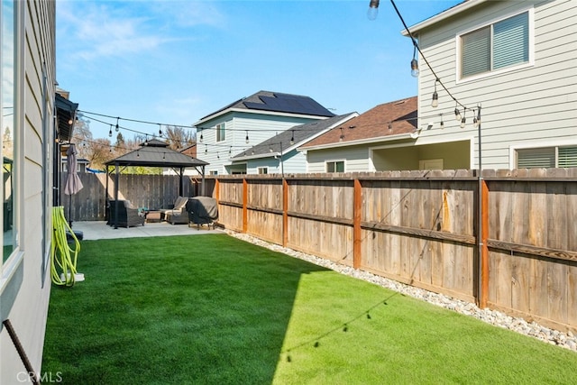 view of yard with a gazebo, a patio, and a fenced backyard