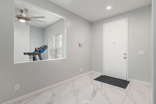 foyer entrance featuring marble finish floor, baseboards, a ceiling fan, and recessed lighting