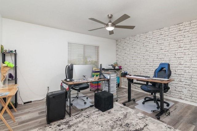 home office with ceiling fan and wood finished floors