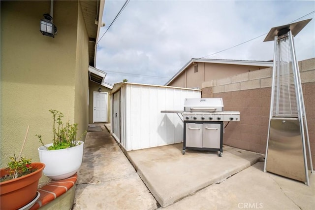 view of patio / terrace with fence and grilling area