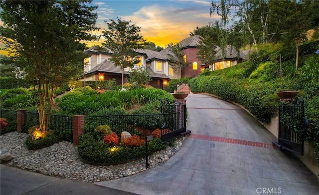 view of front of home featuring fence