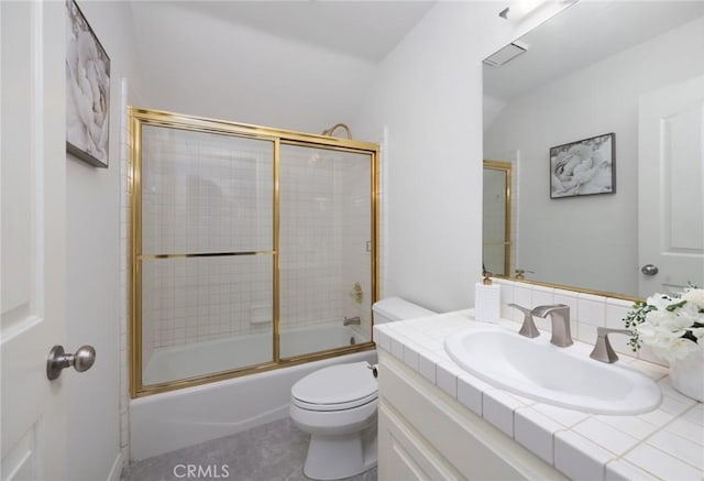 bathroom featuring toilet, visible vents, bath / shower combo with glass door, and vanity