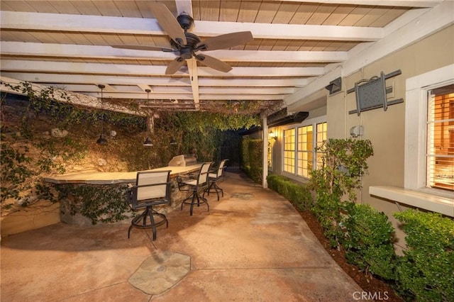 view of patio / terrace featuring a ceiling fan and outdoor dining space