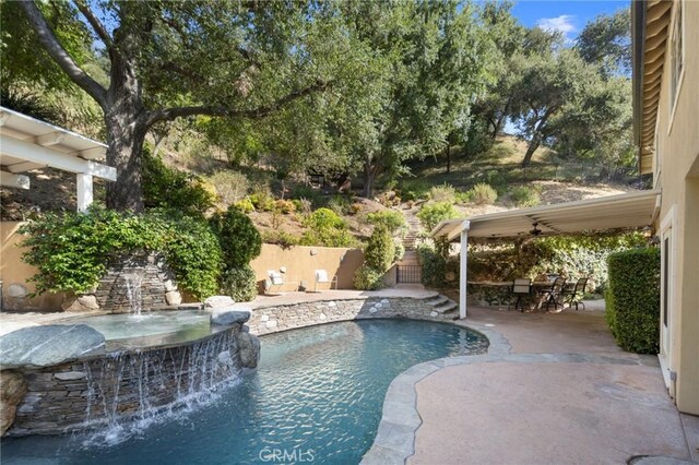 view of pool with a fenced in pool, a patio, and fence