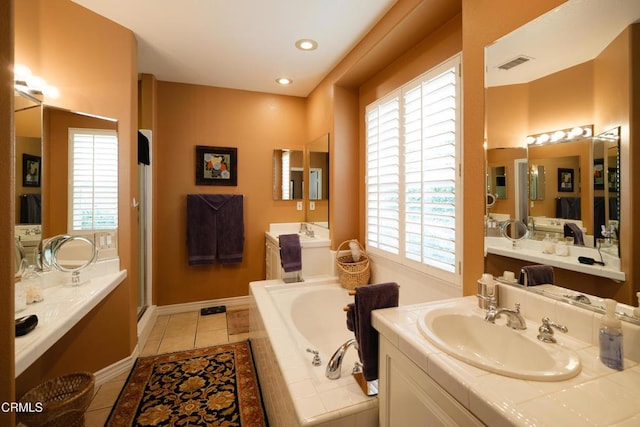 full bath featuring visible vents, tile patterned floors, a sink, a shower stall, and a bath