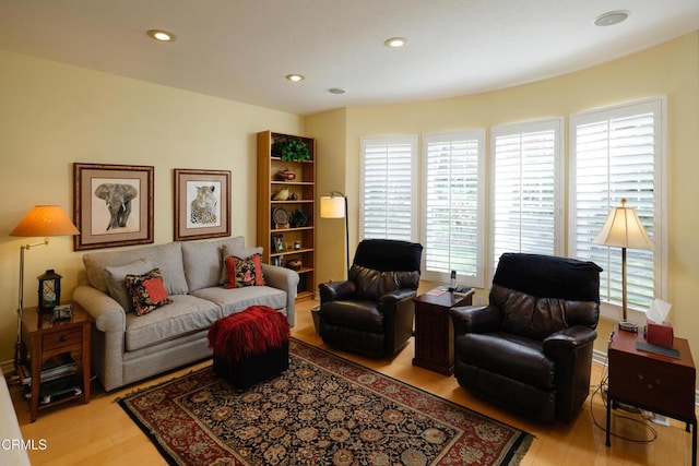 living area featuring light wood finished floors and recessed lighting