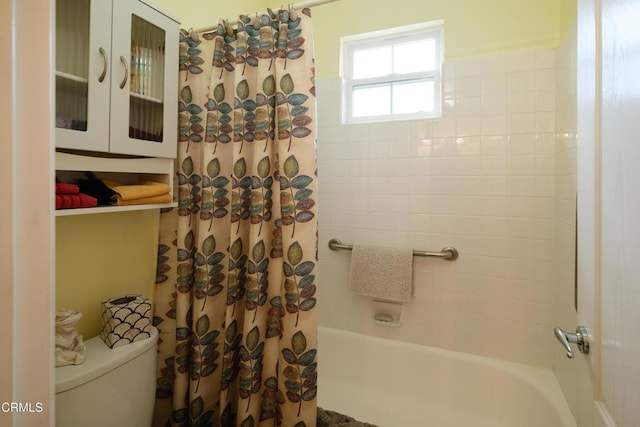 full bath featuring toilet and shower / bath combination with curtain