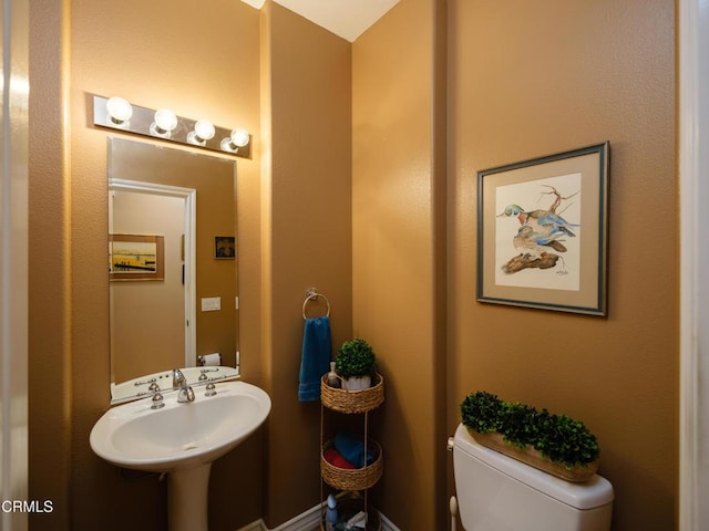 bathroom with a sink and toilet