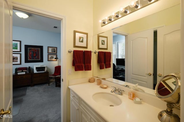 bathroom with vanity and visible vents