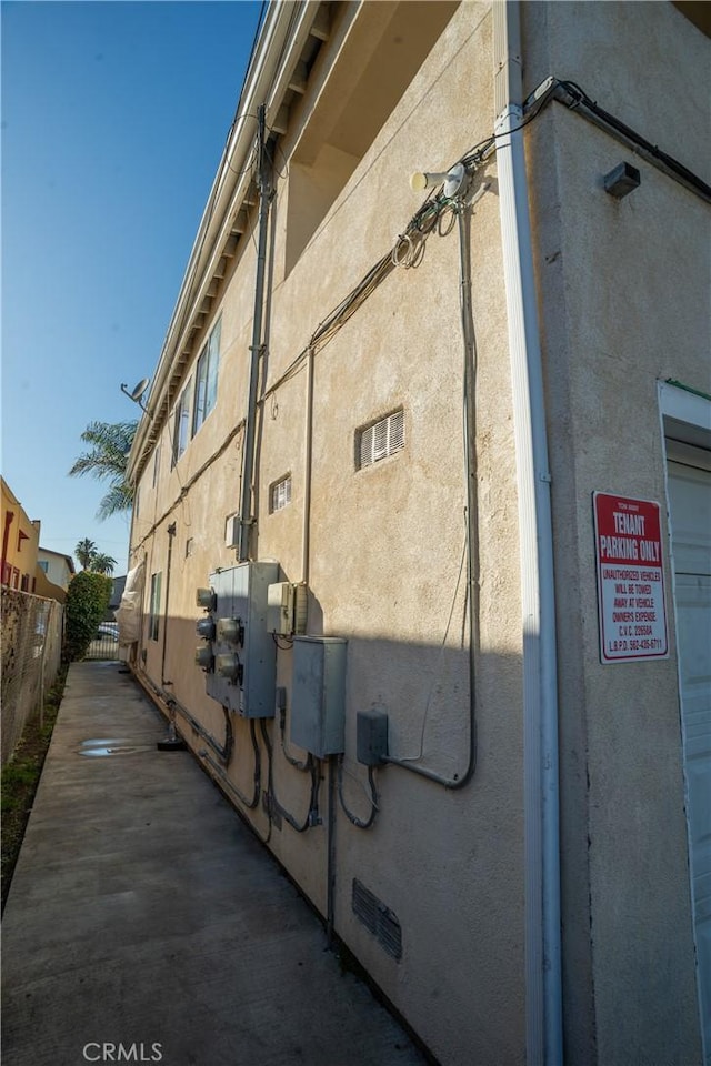 view of building exterior featuring fence