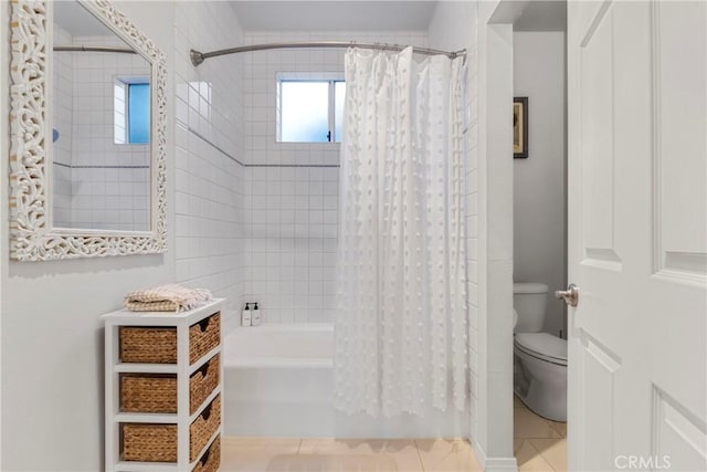 full bathroom with tile patterned flooring, toilet, and shower / bath combo