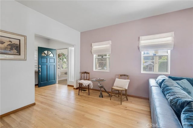 sitting room featuring light wood-style flooring and baseboards