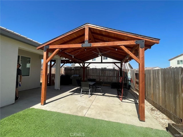 view of patio featuring a gazebo and fence