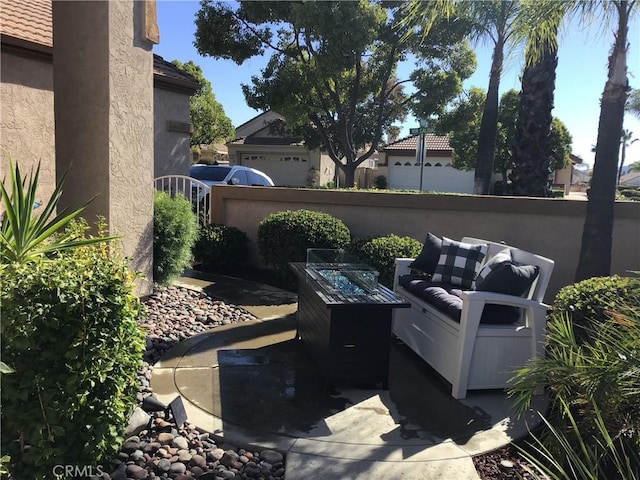 exterior space with fence and a fire pit