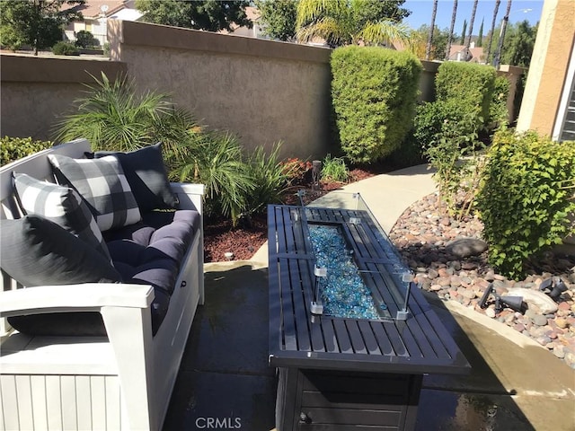 view of patio / terrace featuring fence