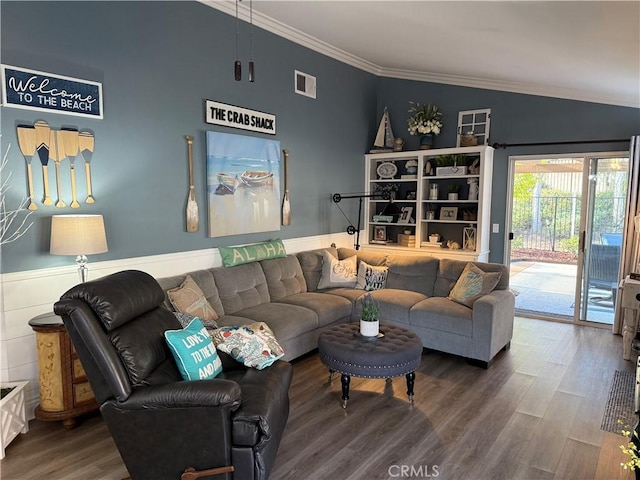 living area featuring vaulted ceiling, ornamental molding, wood finished floors, and visible vents