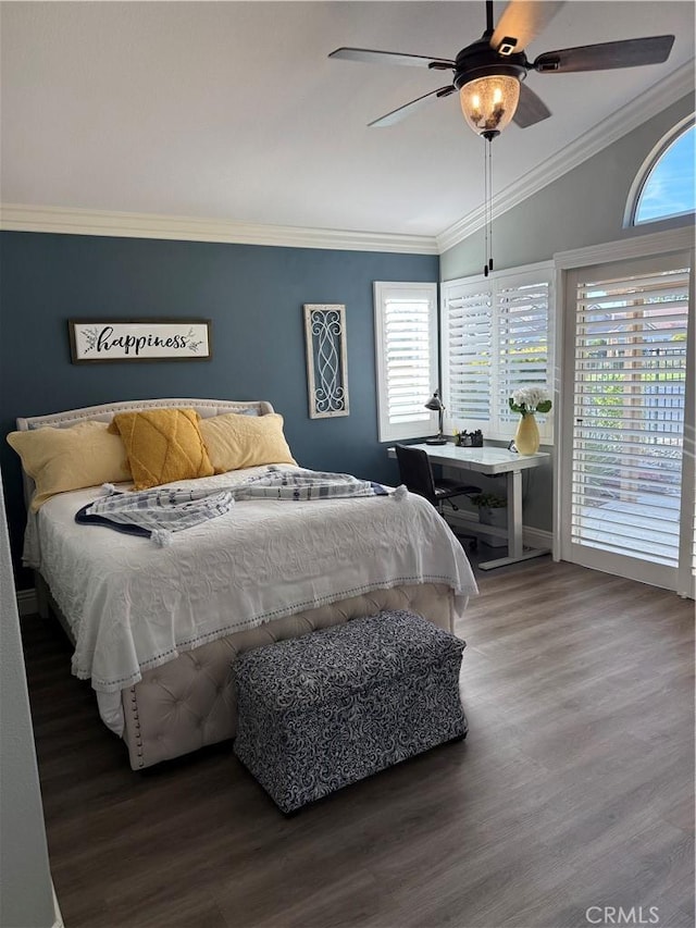 bedroom featuring access to outside, multiple windows, ornamental molding, and wood finished floors