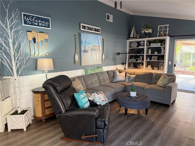 living room featuring wood finished floors, visible vents, and crown molding