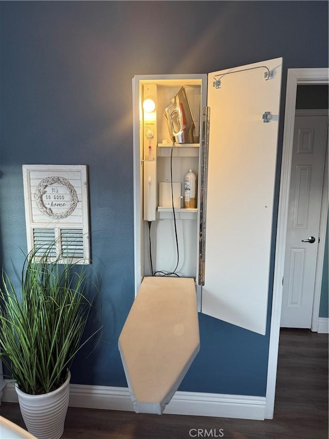 details with baseboards and wood finished floors