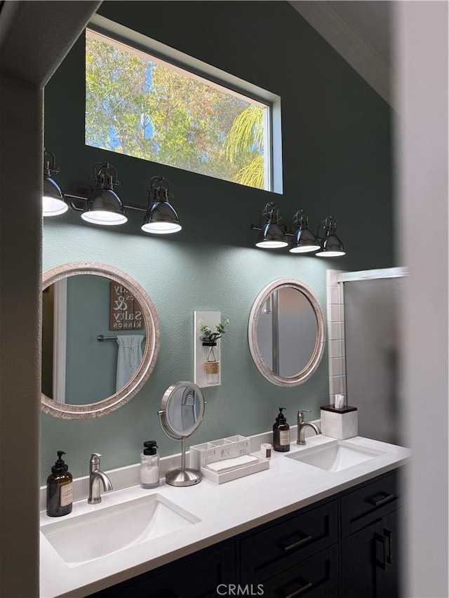 bathroom with double vanity and a sink